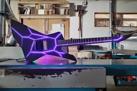 Image of electric guitar with purple LED lights in body and fret